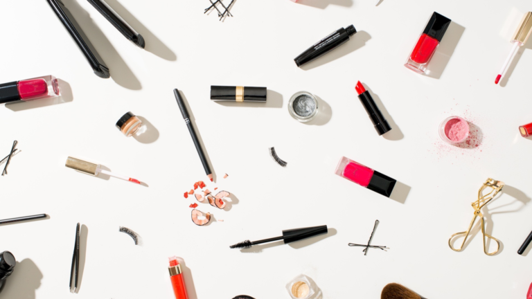 Flat lay of various beauty and makeup products
