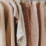 Neutral color women's summer clothes on a clothing rack