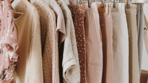 Neutral color women's summer clothes on a clothing rack