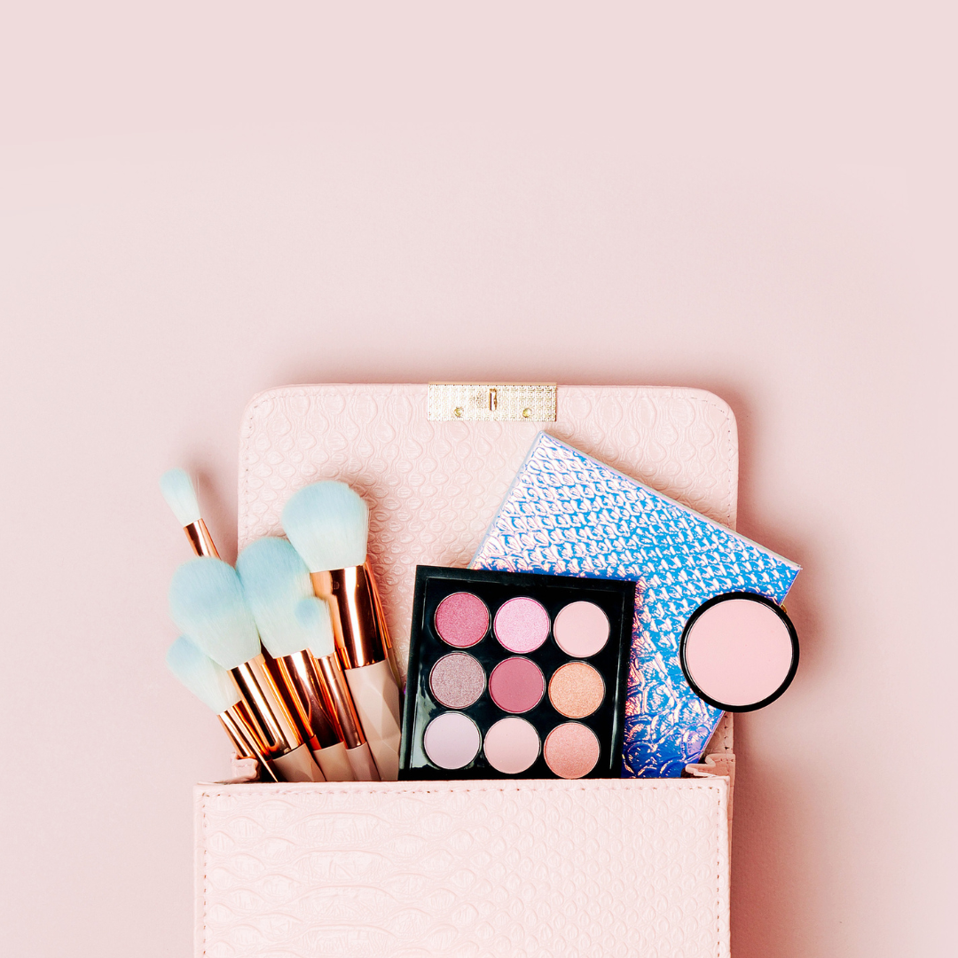 Flat lay top view of a makeup bag with beauty products