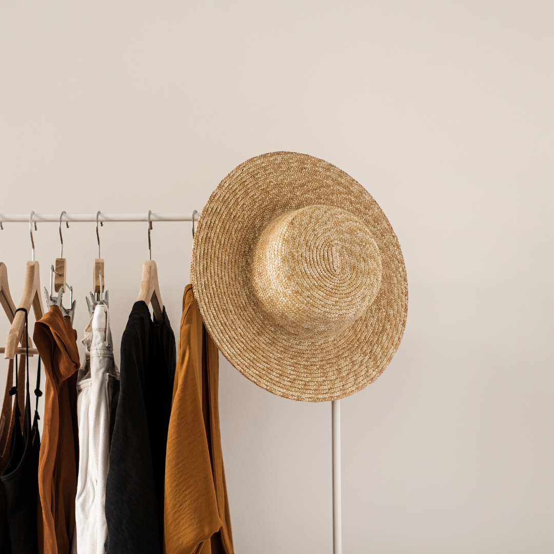 Women clothes in neutral colors on a clothing rack