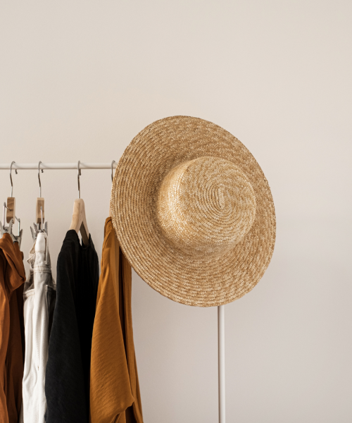 Women clothes in neutral colors on a clothing rack