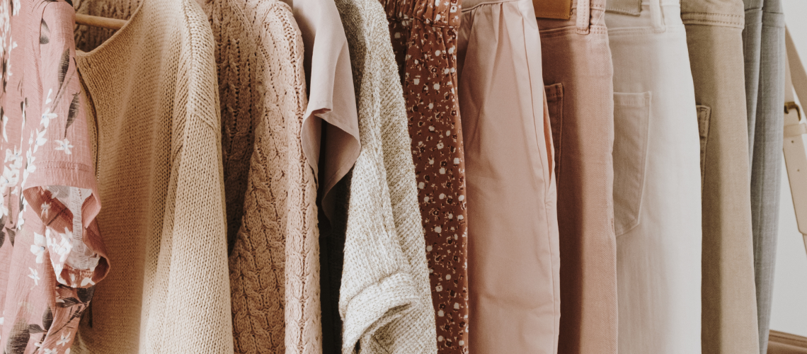 Summer capsule Neutral color women's summer clothes on a clothing rack